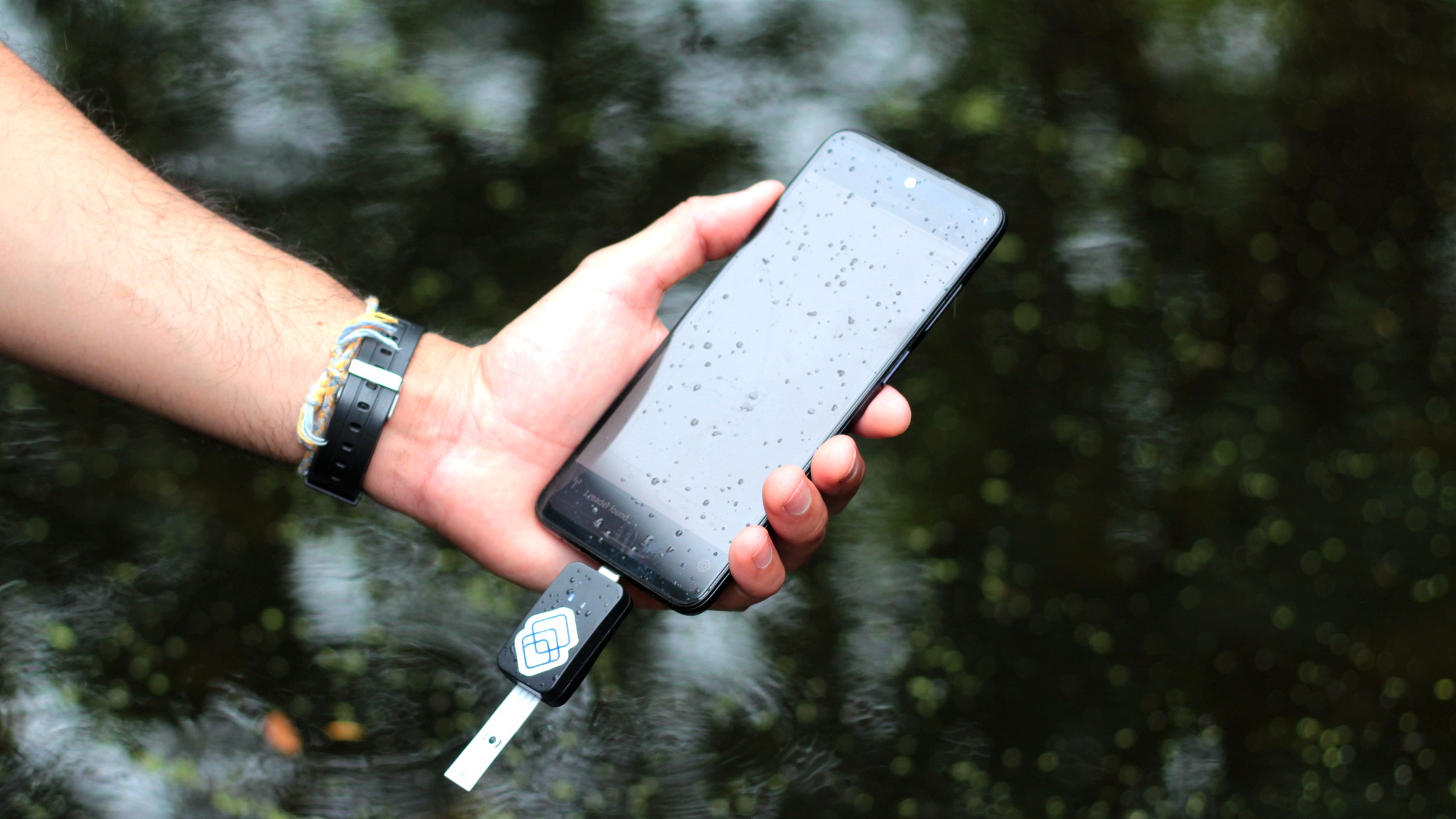 Segura reader and phone being used over an open body of water
